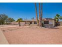 Charming single-story home featuring mature palm trees, low brick facade, and desert landscaping at 3620 S Terrace Rd, Tempe, AZ 85282