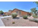 Charming single-story home featuring desert landscaping, a tile roof, and an inviting curb appeal at 40468 W Sanders Way, Maricopa, AZ 85138