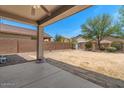 Spacious backyard with a covered patio, offering ample space for outdoor enjoyment at 4380 W White Canyon Rd, San Tan Valley, AZ 85144