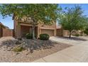 Charming two-story home with a well-manicured front yard and a two-car garage at 4380 W White Canyon Rd, San Tan Valley, AZ 85144