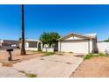 Modest single story home with a desert landscape, and a single car garage at 1602 N 73Rd Dr, Phoenix, AZ 85035