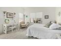 Bright bedroom with large windows, neutral carpet, and a relaxing area for reading at 19546 N 53Rd Ave, Glendale, AZ 85308