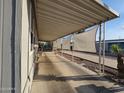 Extended covered parking area providing ample shade and convenience, enhancing the property's appeal at 2121 N Center St # 131, Mesa, AZ 85201