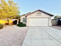 Single-story home featuring a low-maintenance desert landscape and attached two-car garage at 22951 W Loma Linda Blvd, Buckeye, AZ 85326