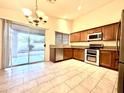 This kitchen boasts stainless appliances, lots of cabinet space, and a sliding glass door to the backyard at 22951 W Loma Linda Blvd, Buckeye, AZ 85326