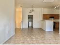 Bright living area showcases tile floors, natural light, and a laundry closet conveniently located nearby at 2402 E 5Th St # 1472, Tempe, AZ 85288