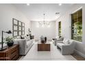 Bright living room with modern decor, chandelier, and ample natural light at 2743 E Virginia St, Gilbert, AZ 85296