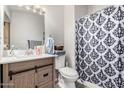 Well-maintained bathroom with modern vanity, patterned shower curtain, and fresh towels at 3646 N 67Th Ave # 29, Phoenix, AZ 85033