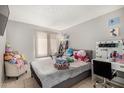 Cozy bedroom featuring neutral colors, a comfortable bed, and a vanity area at 3646 N 67Th Ave # 29, Phoenix, AZ 85033