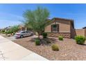 Charming single-story home with desert landscaping, a private front yard, and a two-car garage at 36922 N Camarillo Dr, San Tan Valley, AZ 85140