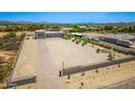 Aerial view displaying the property's spacious lot, desert landscape, and detached multi-car garage at 38415 N 25Th Ave, Phoenix, AZ 85086