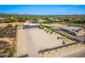An aerial perspective of the expansive property showcasing its large lot, desert landscape and multi-vehicle garage at 38415 N 25Th Ave, Phoenix, AZ 85086