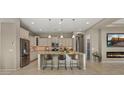 Beautiful kitchen featuring stainless steel appliances, granite countertops and a spacious island with seating at 4341 E Evelyn St, Gilbert, AZ 85295