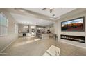 Spacious open-concept living area with modern fireplace and large windows for natural light at 4341 E Evelyn St, Gilbert, AZ 85295