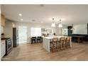 Open kitchen boasts a large island with seating and stylish decor at 547 W Orangewood Ave, Phoenix, AZ 85021