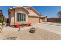 Charming single-story home showcasing desert landscaping and a welcoming facade at 6610 E University Dr # 2, Mesa, AZ 85205