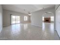 Spacious living area showcasing an open floor plan with a brick fireplace at 7549 W Yucca St, Peoria, AZ 85345