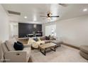 Spacious living room with plush seating, ceiling fan, and decorative rug at 8022 E Columbus Ave, Scottsdale, AZ 85251