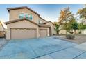 Beautiful two-story home with a three-car garage and a spacious driveway at 8621 W Morten Ave, Glendale, AZ 85305