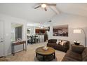 Open-concept living area leading to the dining room and kitchen, with neutral tones and ample space at 10115 E Mountain View Rd # 2061, Scottsdale, AZ 85258