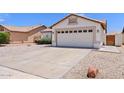 Charming single-story home featuring a two-car garage, desert landscaping, and a well-maintained yard at 10617 W Ross Ave, Peoria, AZ 85382