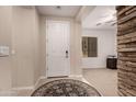 Inviting home entry featuring tile floors and stone accents, with ample natural light at 1643 N 144Th Dr, Goodyear, AZ 85395