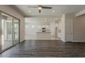 Bright, open-concept living area flows into a modern kitchen with a large sliding door at 16836 W Vereda Solana Dr, Surprise, AZ 85387