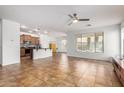 Open-concept living space with tile floors and plenty of natural light at 1721 W Kingbird Dr, Chandler, AZ 85286