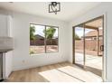 Bright dining area with sliding glass doors and view of the backyard and patio at 2112 S 160Th Dr, Goodyear, AZ 85338