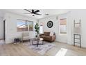 Inviting living room showcasing a comfortable seating arrangement and bright airy windows at 2112 S 160Th Dr, Goodyear, AZ 85338