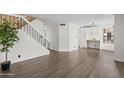 Open concept living room with sleek flooring and staircase, perfect for modern living at 2455 E Broadway Rd # 122, Mesa, AZ 85204