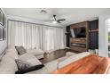 Inviting living room with stylish decor, a cozy sectional, and a modern fireplace at 25210 N 40Th Ave, Phoenix, AZ 85083