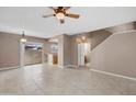 Spacious living room with neutral paint, fan, and tile flooring offers a welcoming atmosphere at 2986 N Oregon St # 7, Chandler, AZ 85225