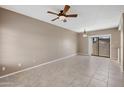 Spacious living room with neutral paint, fan, and tile flooring offers a welcoming atmosphere at 2986 N Oregon St # 7, Chandler, AZ 85225
