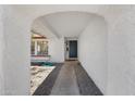 Covered entryway with textured walls leading to front door at 3021 E Harmony Cir, Mesa, AZ 85204