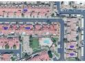 Aerial view showcasing the community layout, pool, green spaces, and proximity to local amenities at 3510 E Hampton Ave # 133, Mesa, AZ 85204