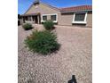 Charming single-story home with desert landscaping, a neutral color palette and red roof tiles at 3510 E Hampton Ave # 133, Mesa, AZ 85204