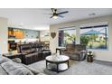 Bright living room with views to the outside, showcasing the flow of the living space at 42711 W Darter Dr, Maricopa, AZ 85138