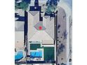 Aerial view of private backyard with refreshing pool, artificial turf, and patio area at 5403 W Novak Way, Laveen, AZ 85339