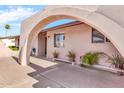 Arched entryway to single-story home featuring desert landscaping at 6055 E Hannibal St, Mesa, AZ 85205