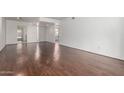 Bright living room featuring hard surface flooring and a modern open floorplan at 611 E Colgate Dr, Tempe, AZ 85283