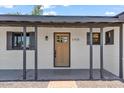 Welcoming front entrance with a newly painted door and stylish exterior design elements at 6908 E Windsor Ave, Scottsdale, AZ 85257