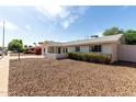 Charming single-story home featuring a low-maintenance front yard and a quaint, covered entrance at 7440 E Hubbell St, Scottsdale, AZ 85257