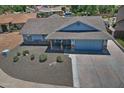 Charming single-Gathering home featuring a spacious driveway, well-maintained landscaping, and a welcoming facade at 927 N Somerset Cir, Mesa, AZ 85205