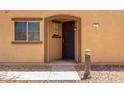 Close-up of the front entrance featuring security screen door and charming light fixture at 1250 S Rialto -- # 78, Mesa, AZ 85209