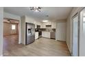 Well-lit kitchen with stainless steel appliances, tile backsplash, ample storage and vinyl floors at 14002 N 38Th St, Phoenix, AZ 85032