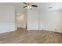 Open-concept floor plan with wood-look floors and lots of natural light at 15853 N 74Th Ave, Peoria, AZ 85382