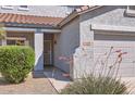 Close up of front entrance showing covered porch and desert landscaping at 15955 N Cristine Ln, Surprise, AZ 85388