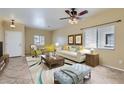 Staged living room featuring tile floors, neutral paint and modern decor at 15955 N Cristine Ln, Surprise, AZ 85388