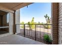 A cozy balcony offers views of desert landscaping and a clear blue sky, perfect for relaxation at 16852 E La Montana Dr # C18, Fountain Hills, AZ 85268